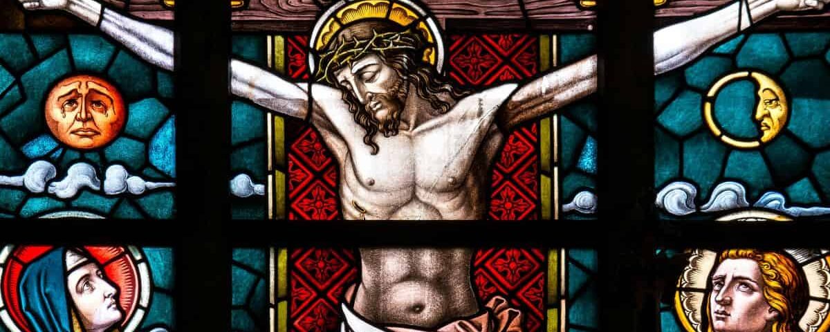Stained glass image of Jesus Christ hanging on cross