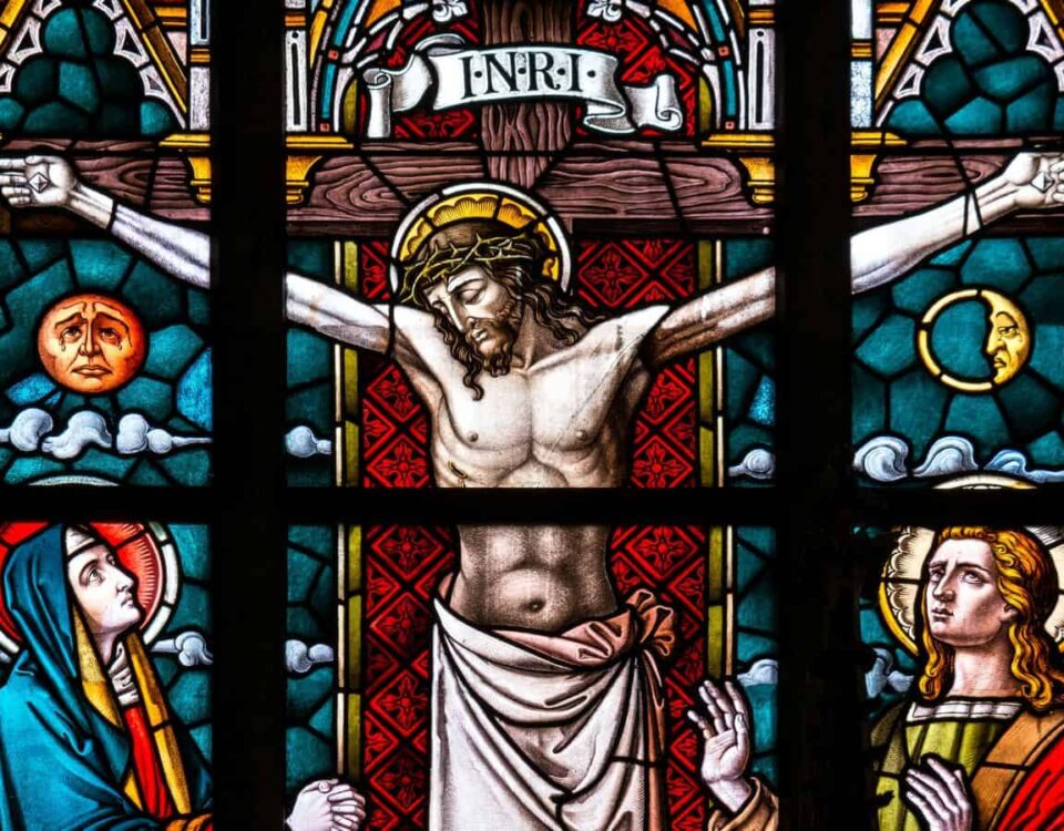 Stained glass image of Jesus Christ hanging on cross