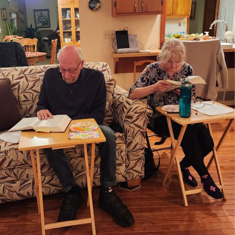 Man and woman reading Bible at Home Huddle at Bethlehem Lutheran Church in West Dundee, IL