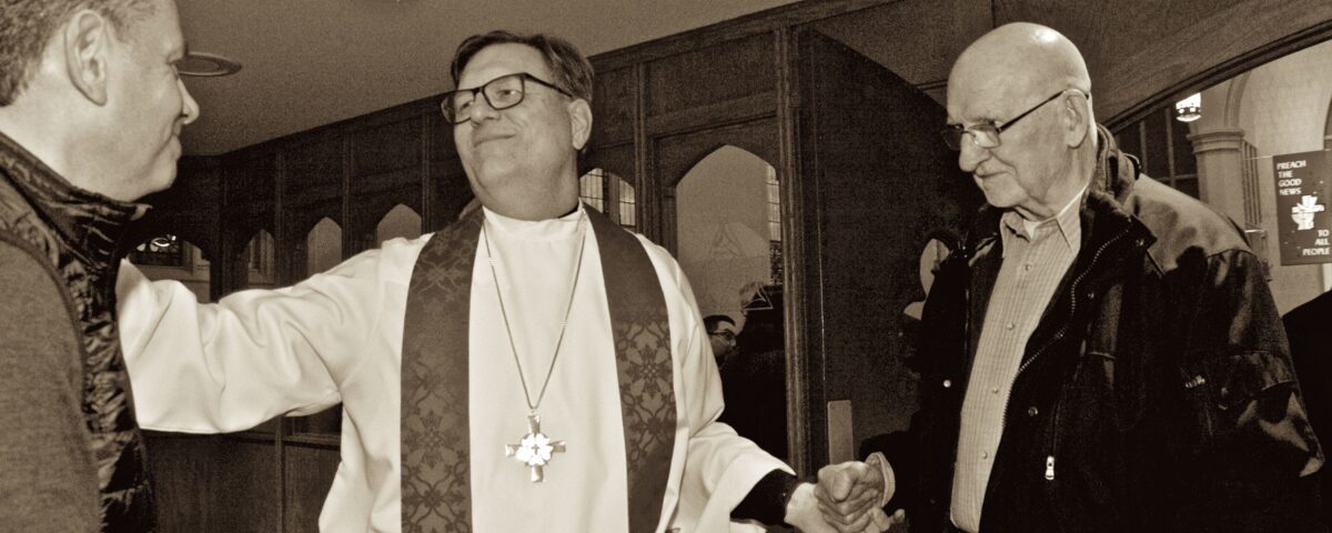 Pastor Joe Glombicki greeting members at Bethlehem Lutheran Church in West Dundee, IL