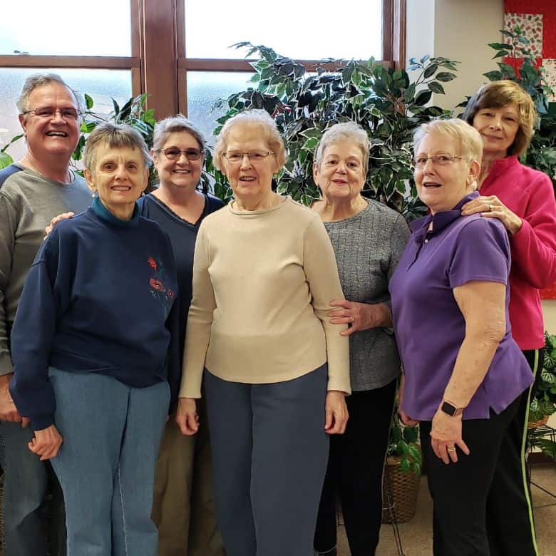 Smiling group of women and men at Pilates class at Bethlehem Lutheran Church in West Dundee, IL
