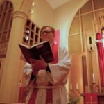 Pastor Joe Glombicki holding Lutheran Service Book at Bethlehem Lutheran Church in West Dundee, IL